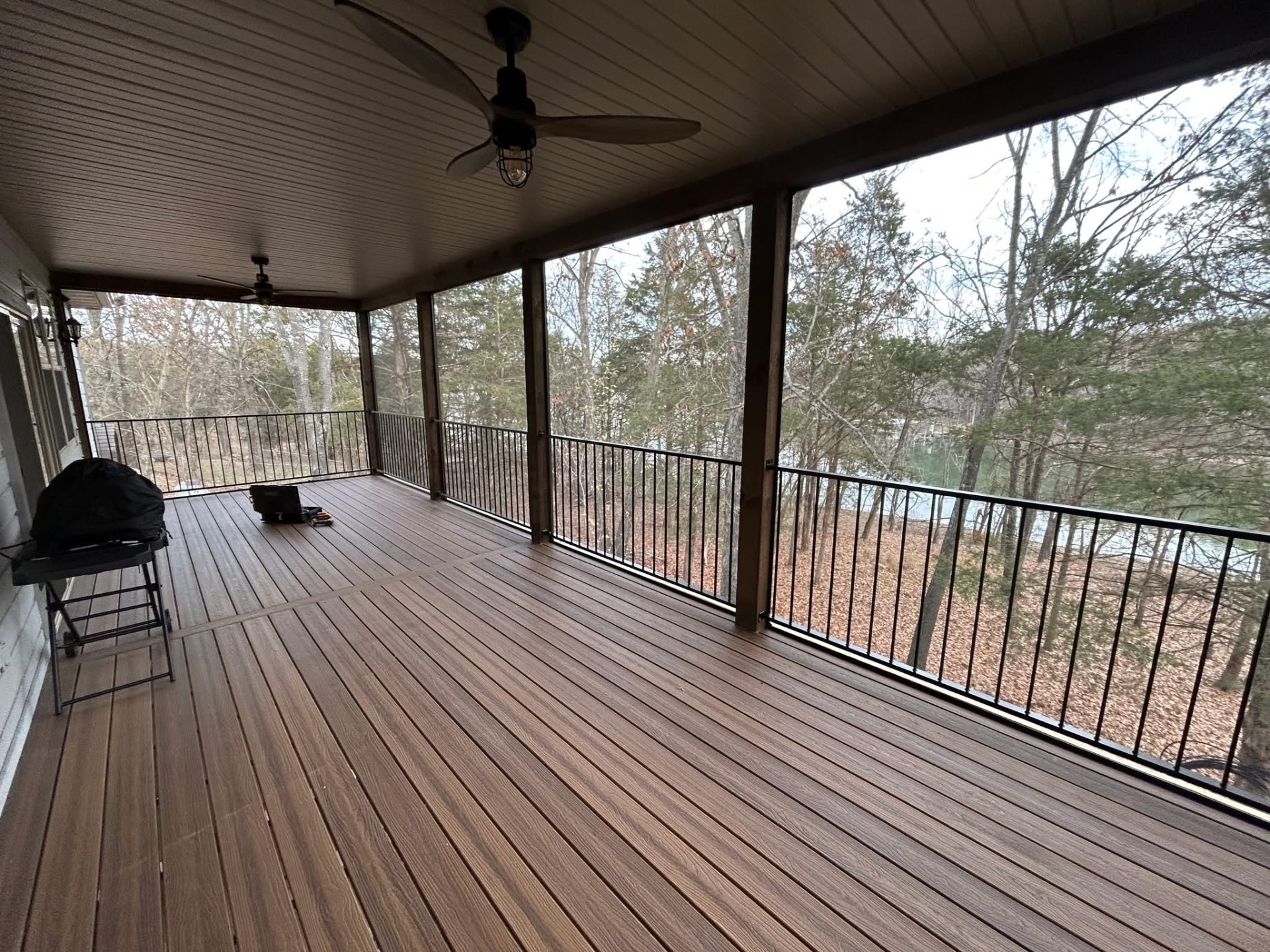 Composite lakefront deck with cable railing overlooking Table Rock Lake